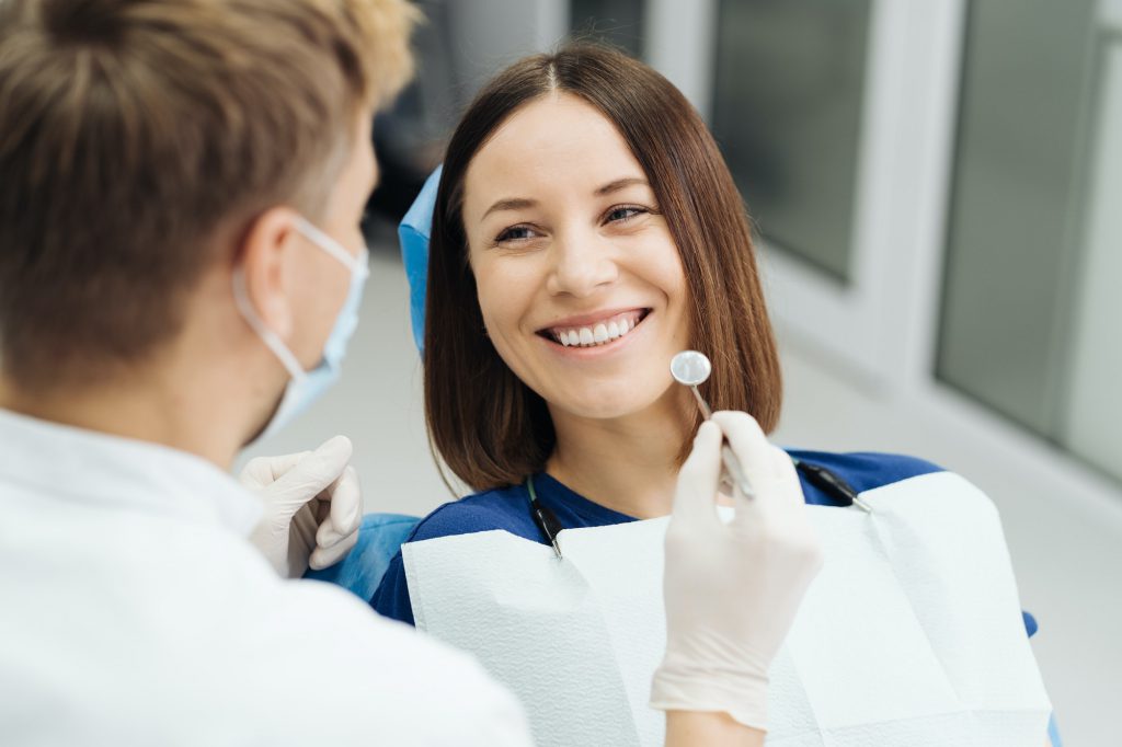 Dentist discussing with patient treatment plan